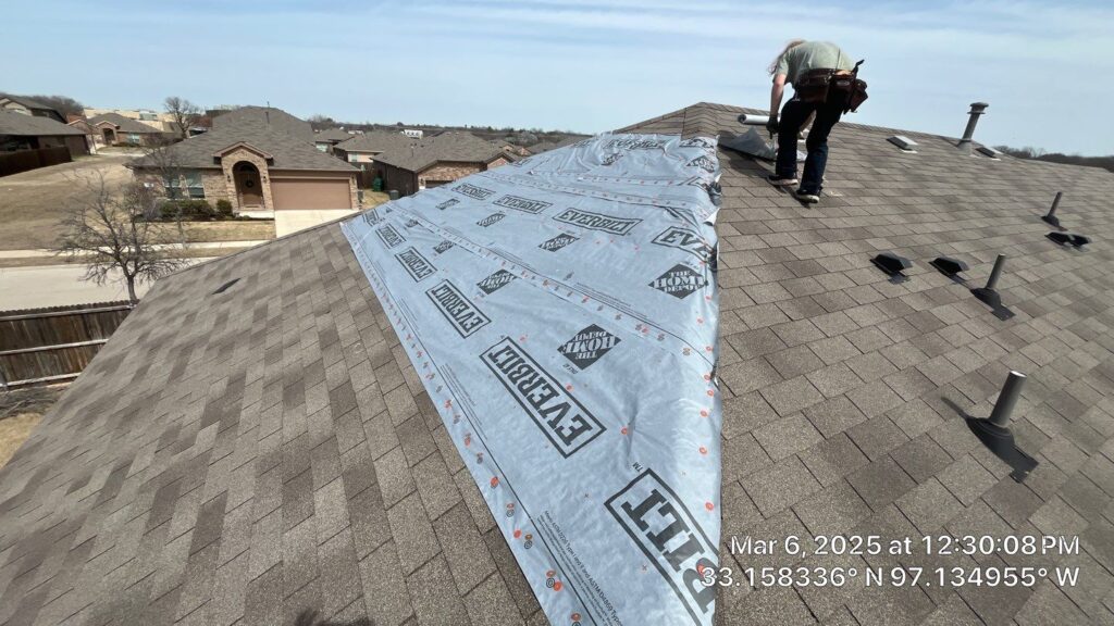 Roofer installing new roofing materials on a residential home in the Dallas-Fort Worth Metroplex, showcasing
