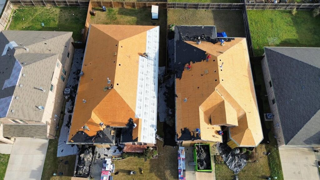 Aerial view of residential roof replacement project in progress by Roofing Redefined.