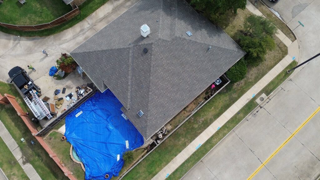 Aerial view of a completed roofing project in the Dallas-Fort Worth Metroplex, showcasing Roofing Redefined's